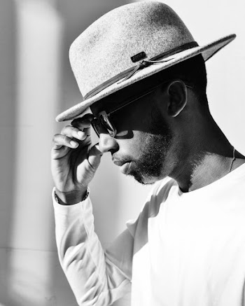 Photo Of Man Holding Sunglasses