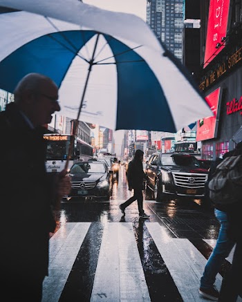 Photo Of Man Holding Umbrella