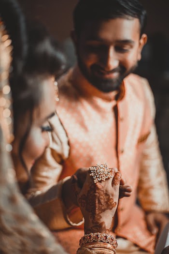 Photo Of Man Holding Woman's Hand