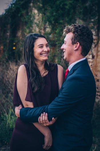 Photo of Man Hugging Woman
