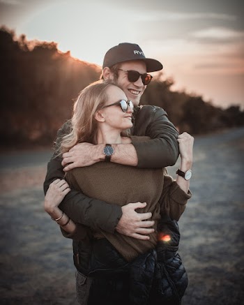 Photo of Man Hugging Woman