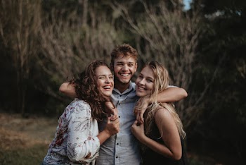 Photo of Man Hugging Women