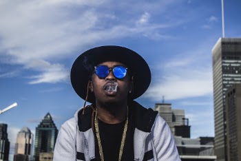 Photo of Man in Black Hat and Sunglasses Smoking