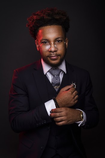 Photo of Man in Black Suit Posing