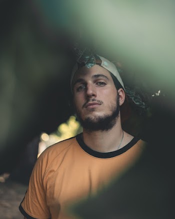 Photo of Man in Grey Hat and Yellow T-shirt