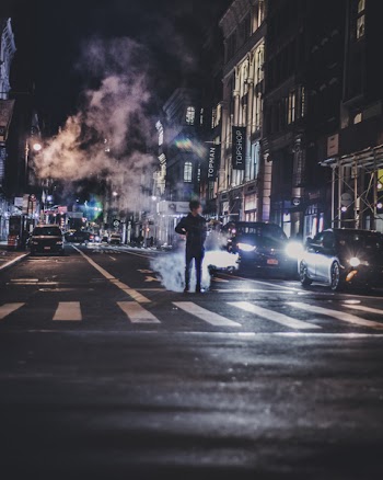 Photo of Man in the Middle of the Road