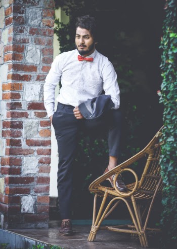 Photo of Man in White Shirt and Black Pants