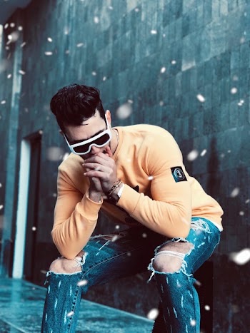 Photo of Man in Yellow Crew-neck Sweater Posing