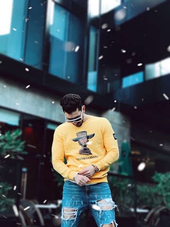Photo of Man in Yellow Long-sleeved Sweatshirt Standing Outdoor