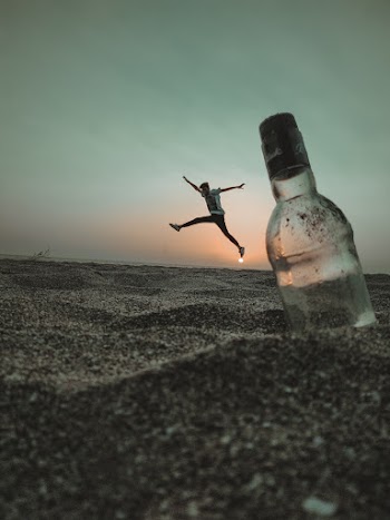 Photo of Man Jumping on Sand