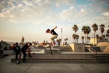Photo Of Man Jumping With Skateboard