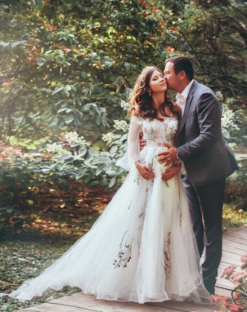 Photo Of Man Kissing His Wife