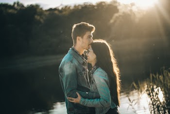 Photo of Man Kissing Woman's Forehead