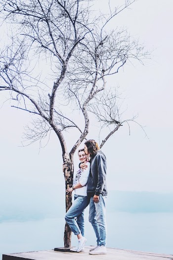 Photo Of Man Kissing Woman's Head