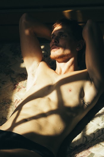 Photo of Man Laying On Bed