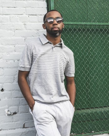 Photo Of Man Leaning On Brick Wall