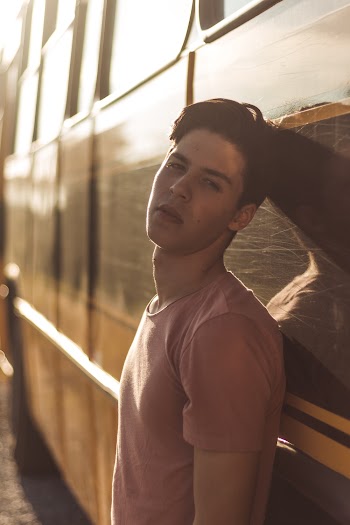 Photo of Man Leaning On Bus