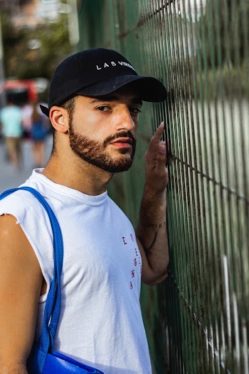 Photo Of Man Leaning On Fence