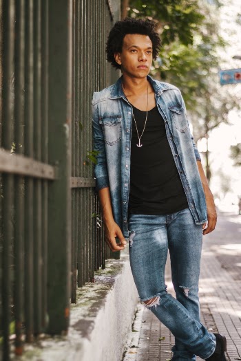 Photo Of Man Leaning On Fence