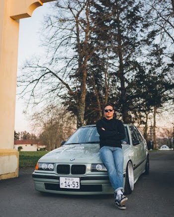 Photo Of Man Leaning On His Car