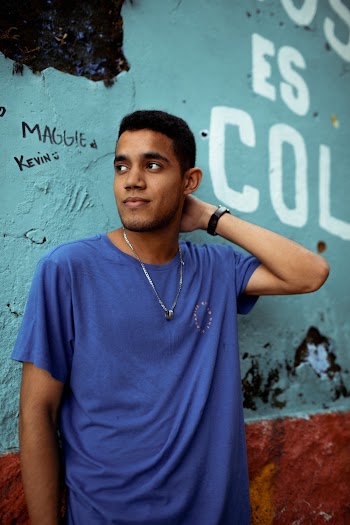 Photo of Man Leaning on Wall