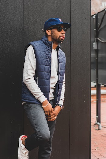 Photo of Man Leaning On Wall