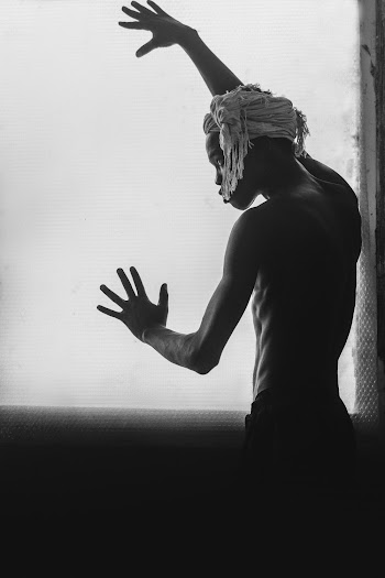 Photo Of Man Leaning On Wall