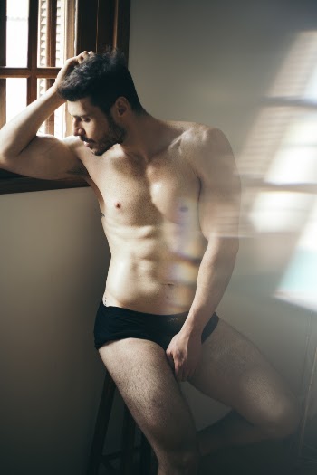 Photo of Man Leaning on Window