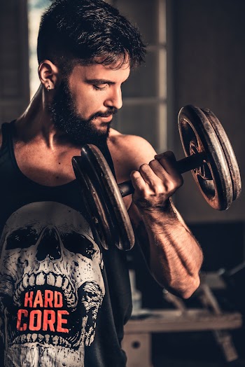 Photo of Man Lifting Dumbbell
