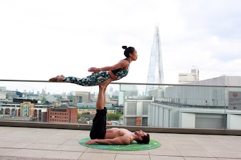 Photo Of Man Lifting Woman Using His Feet