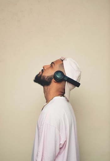 Photo of Man Listening With JBL Wireless Headset
