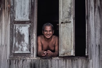 Photo Of Man Looking Outside Window