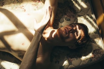 Photo of Man Lying On Beed