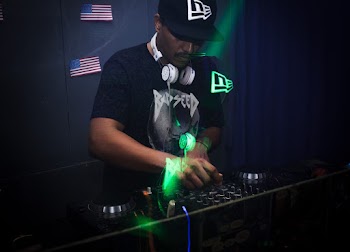 Photo of Man Playing DJ Mixer