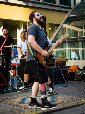 Photo of Man Playing Electric Guitar