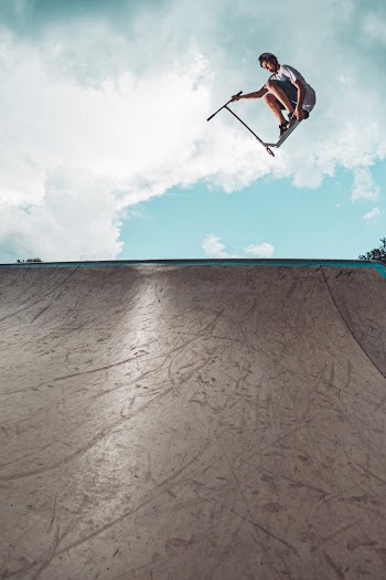 Photo Of Man Playing Skateboard
