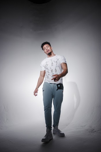 Photo of Man Posing In Front of White Background