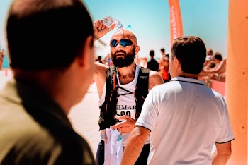 Photo Of Man Pouring Water On His Head