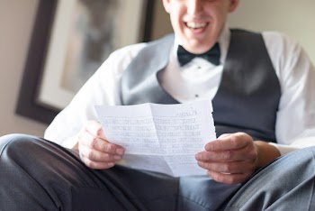 Photo of Man Reading a Letter