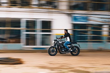 Photo of Man Riding a Motorcycle