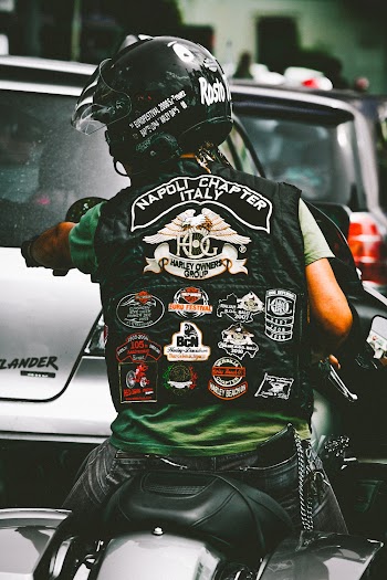 Photo of Man Riding Harley Davidson Motorcycle