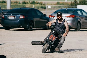 Photo of Man Riding Motorcycle
