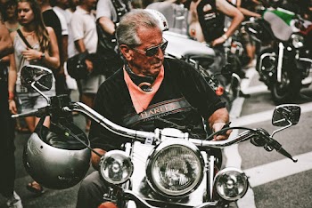 Photo of Man Riding Motorcycle