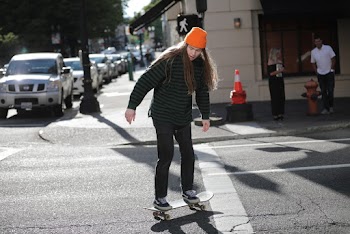 Photo of Man Riding Skateboard