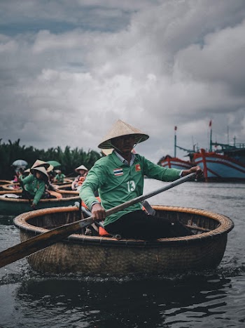 Photo Of Man Rowing Boat