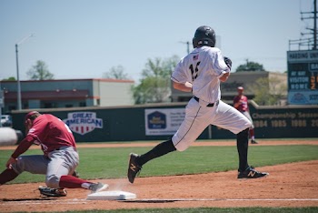 Photo of Man Running on Baseball Field