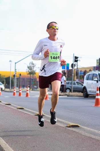 Photo of Man Running on Sidewalk