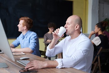 Photo Of Man Sipping Coffee