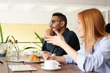 Photo Of Man Sitting Beside Woman 