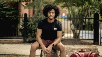 Photo Of Man Sitting On A Block